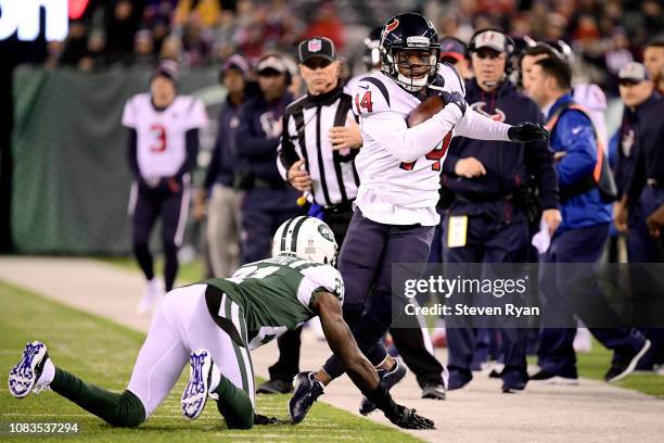 DeAndre Carter of the Houston Texans runs against Morris Claiborne of the New York Jets at MetLife Stadium on December 15, 2018 in East Rutherford,...