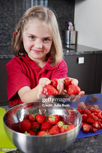 girl preparing strawberries - of strawberry blonde hair stock pictures, royalty-free photos & images