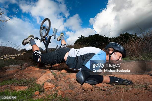 extreme mountain biker - sport injury stock pictures, royalty-free photos & images