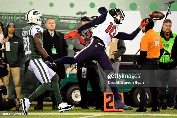 DeAndre Hopkins of the Houston Texans misses a pass attempt under pressure from Morris Claiborne of the New York Jets at MetLife Stadium on December...