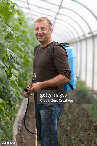 farming vegetables and fruits - backpack sprayer stock pictures, royalty-free photos & images