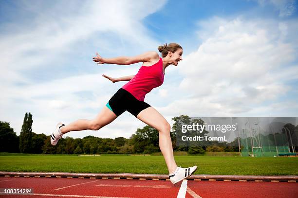 crossing finish line - sprint finish stock pictures, royalty-free photos & images