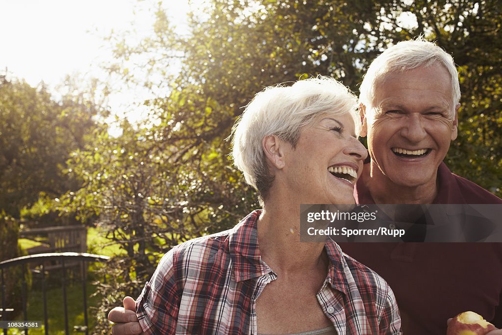 Senior couple in front of lake