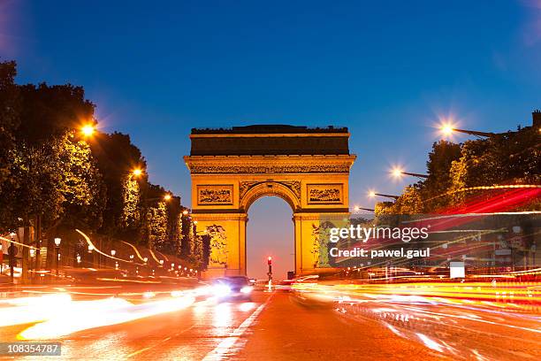 arc de triomphe, paris by night - champs elysees stock pictures, royalty-free photos & images