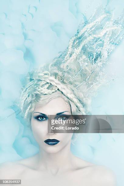 blond hair woman with darken make-up looking at camera - body adornment stock pictures, royalty-free photos & images