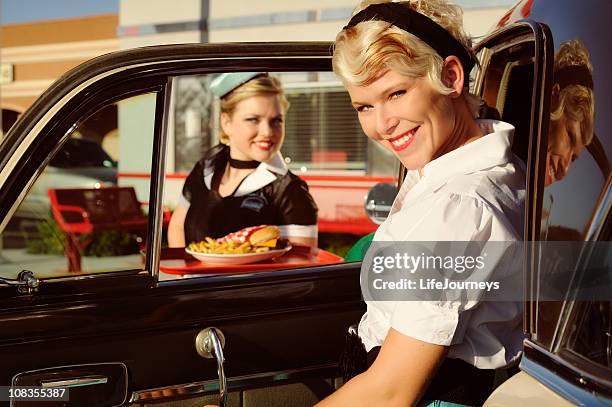 woman at 50's drive in being served by car hop - pillbox hat stock pictures, royalty-free photos & images