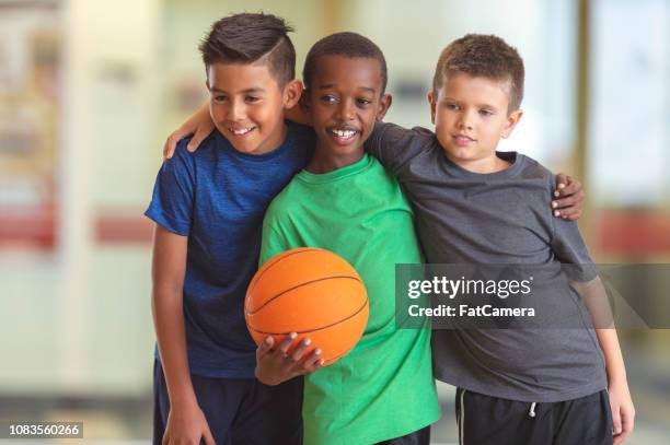 boys with a basketball - ymca stock pictures, royalty-free photos & images