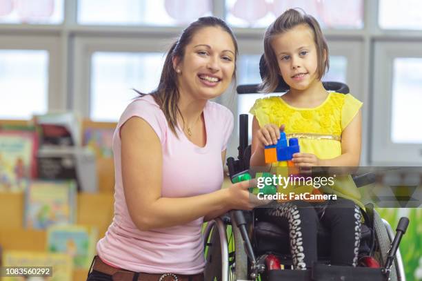 special needs student - school caretaker stock pictures, royalty-free photos & images
