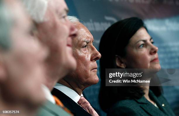 Sen. Rob Portman , Sen. John Cornyn , Sen. Orrin Hatch , and Sen. Kelly Ayotte listen as other Senators speak during a news conference to unveil a...