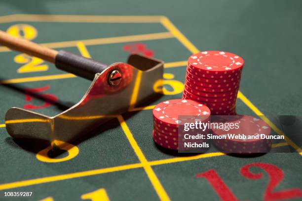 close up of gambling chips on gaming table - croupier stick stock pictures, royalty-free photos & images