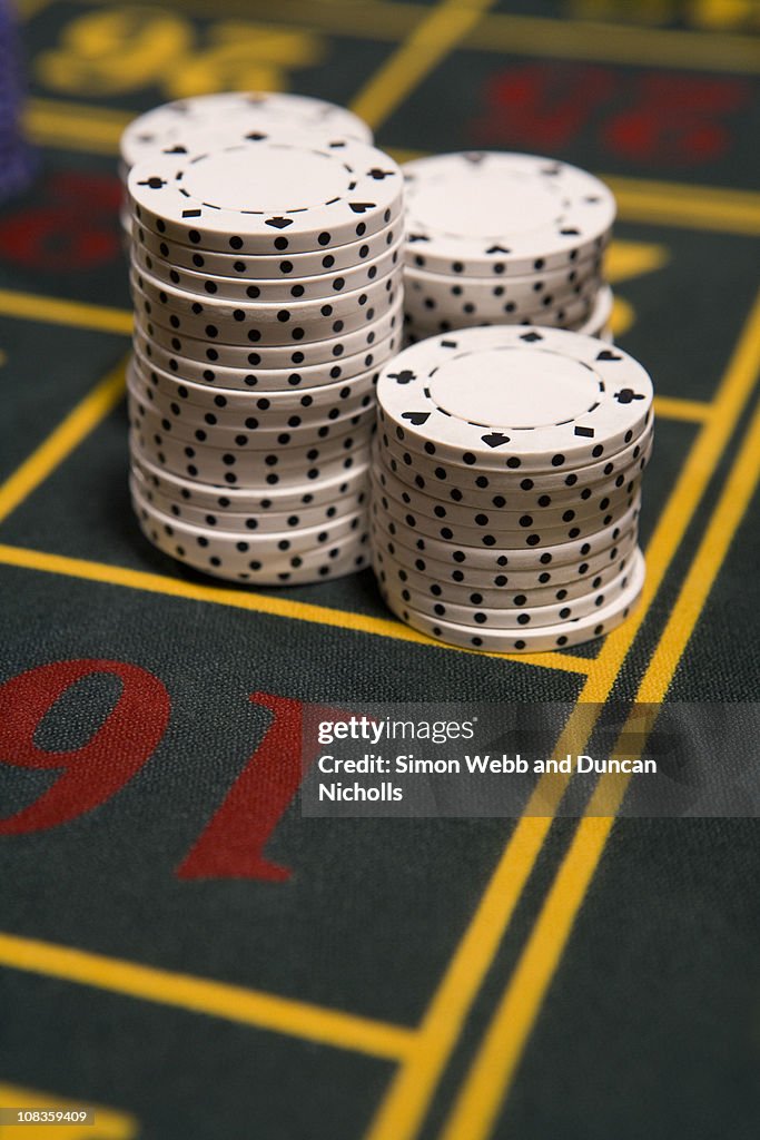 Close up of gambling chips on gaming table