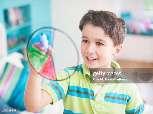 boy drawing pie chart on glass wall - algebra stock pictures, royalty-free photos & images