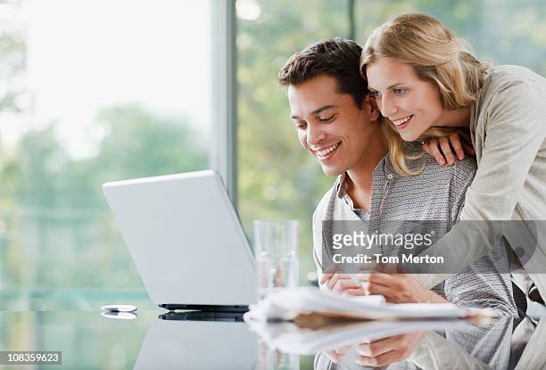 couple shopping online with credit card - customer happiness stock pictures, royalty-free photos & images