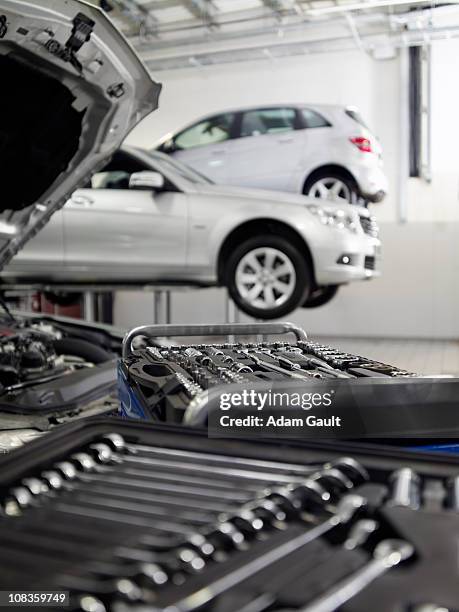 Tools And Car Engine In Auto Repair Shop High-Res Stock Photo