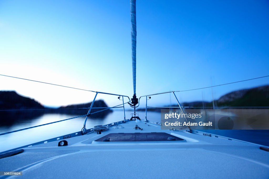 Bow of boat sailing on lake