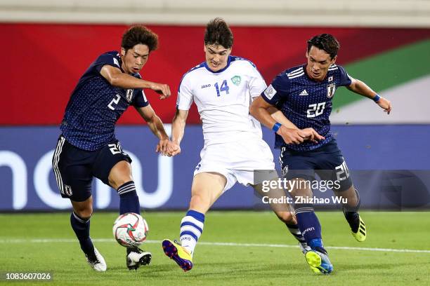 Eldor Shomurodov of Uzbekistan kicks the ball during the AFC Asian Cup Group F match between Japan and Uzbekistsn at Khalifa Bin Zayed Stadium on...