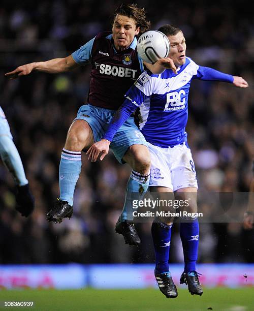 Scott Parker of West Ham United challenges for the ball with Craig Gardner of Birmingham City during the Carling Cup Semi Final Second Leg match...