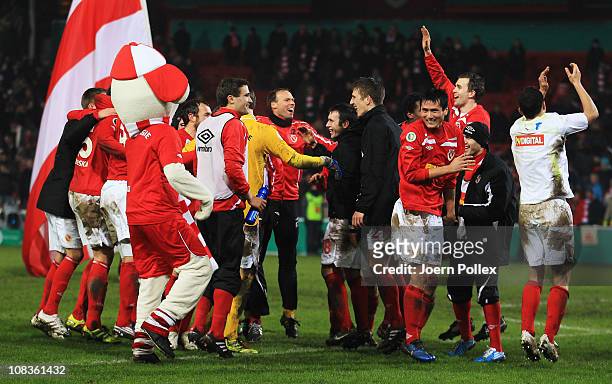The team of Cottbus celebrates after winning the DFB Cup quarter final match between Energie Cottbus and 1899 Hoffenheim at Stadion der Freundschaft...