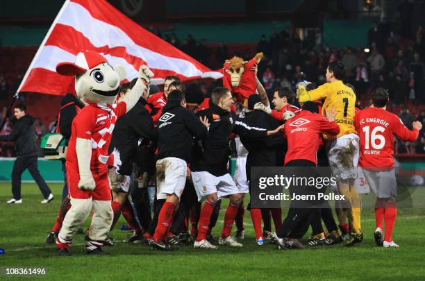 The team of Cottbus celebrates after winning the DFB Cup quarter final match between Energie Cottbus and 1899 Hoffenheim at Stadion der Freundschaft...