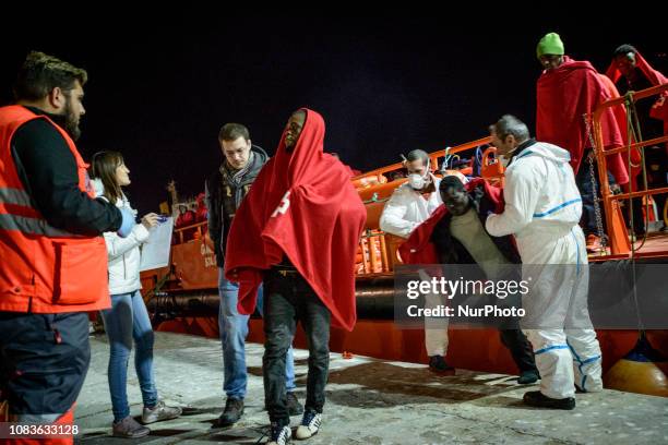 Group of migrants disembarks, helped by the rescue workers. Since the beginning of the year 2019, around 1300 rescued migrants have disembarked at...