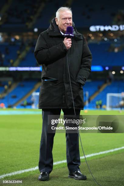 Commentator Martin Tyler speaks into a beIN Sports microphone before the Premier League match between Manchester City and Wolverhampton Wanderers at...