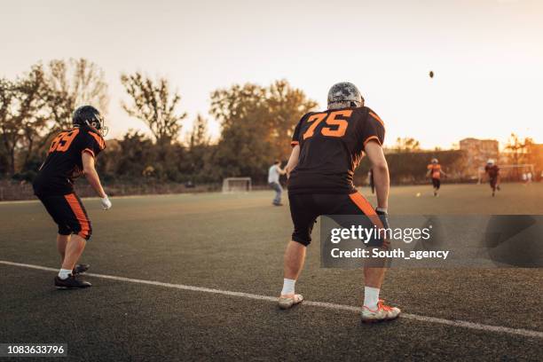 football game - guard american football player stock pictures, royalty-free photos & images