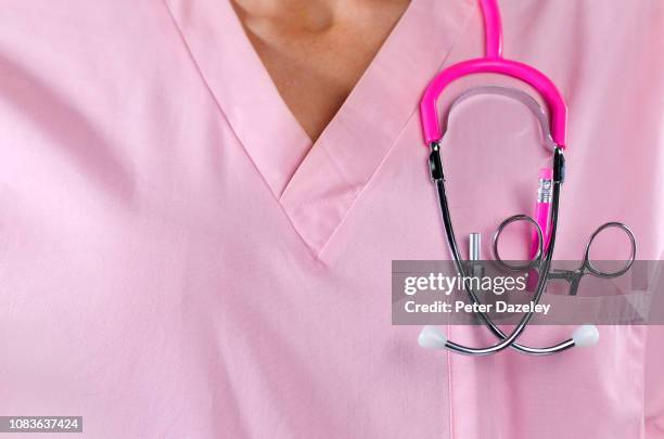 nurse/doctor wearing stethoscope - female nurse uniform stock pictures, royalty-free photos & images