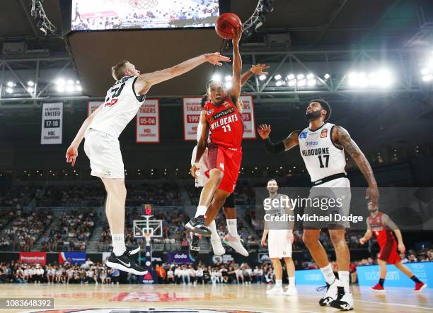 Bryce Cotton of the Wildcats shoots past David Barlow of United and DJ Kennedy of United during the round nine NBL match between the Melbourne United...