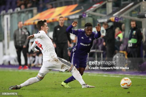 Matej Oravec of Trnava and Francis Amuzu of Anderlecht fight for the ball during the UEFA Europa League Group D match between RSC Anderlecht and FC...