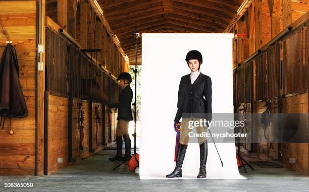 young equestrian isolated on white in barn - horse isolated stock pictures, royalty-free photos & images