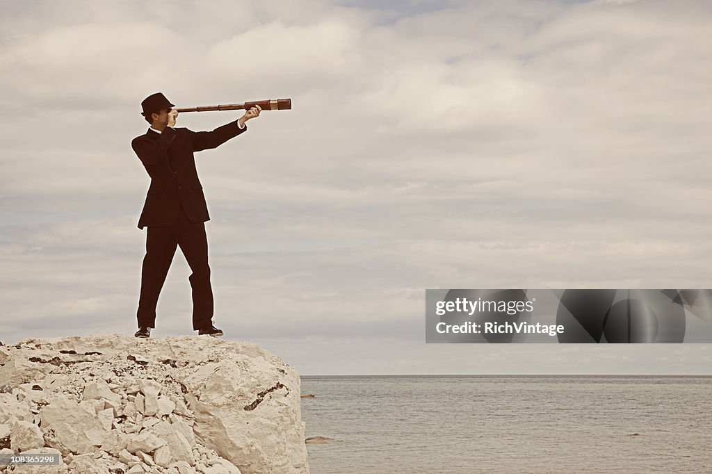 Vintage Male Businessman Looks through Telescope in Denmark