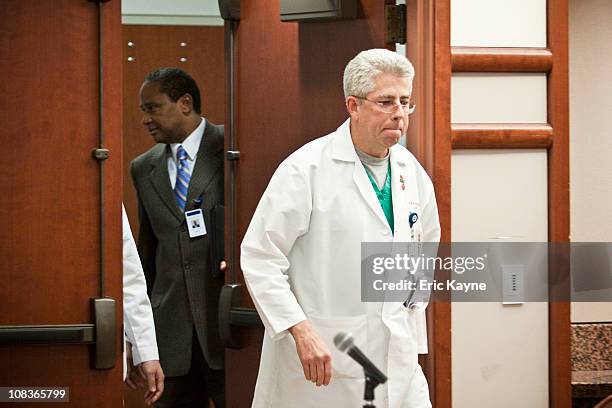 Dr. John Holcomb, trauma surgeon at Memorial Hermann-Texas Medical Center, walks into a press conference to update the media on the condition of U.S....