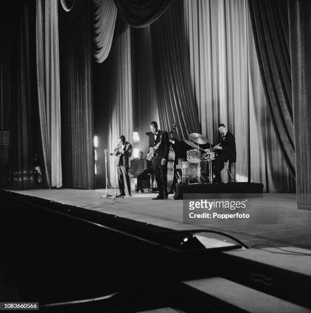 American jazz trumpet player Miles Davis performs live on stage with the Miles Davis Quintet, featuring drummer Jimmy Cobb, saxophonist Sonny Stitt,...