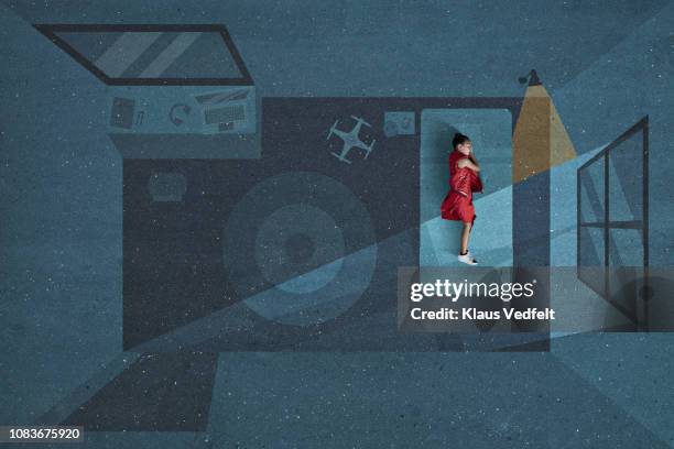 boy laying and sleeping inside painted imaginary bedroom - only boys photos stockfoto's en -beelden