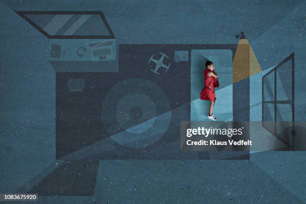 boy laying and sleeping inside painted imaginary bedroom - bed overhead stock pictures, royalty-free photos & images