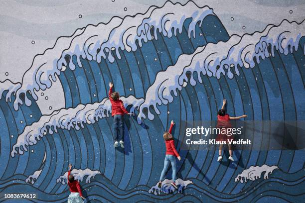 children swimming in imaginary painted waves - child art stockfoto's en -beelden