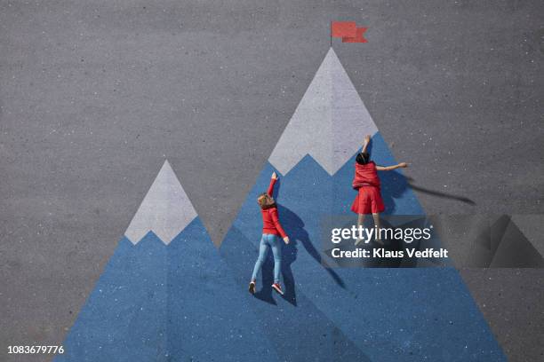 children climbing painted imaginary mountain - land of opportunity drawing stock pictures, royalty-free photos & images