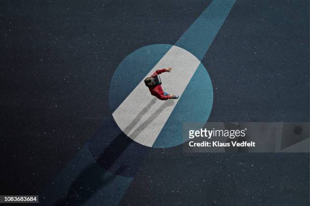 boy wearing vr goggles walking threw painted imaginary spotlight - light circle stock pictures, royalty-free photos & images