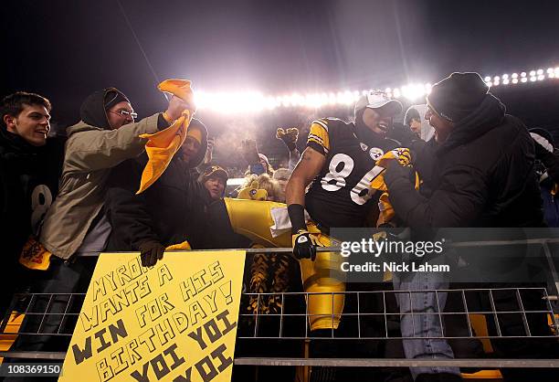 Hines Ward of the Pittsburgh Steelers climbs into the stands to celebrate with fans after their 24 to 19 win over the New York Jets in the 2011 AFC...