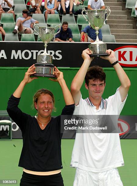 Barbora Strycova of the Czech Republic celebrates with the Girls Singles Trophy with Clement Morel of France who won the Boys Singles Trophy during...