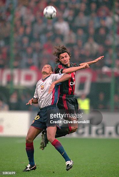 Paolo Maldini of AC Milan outjumps Rivaldo of Barcelona during the UEFA Champions League match at the San Siro in Milan, Italy. The match was drawn...