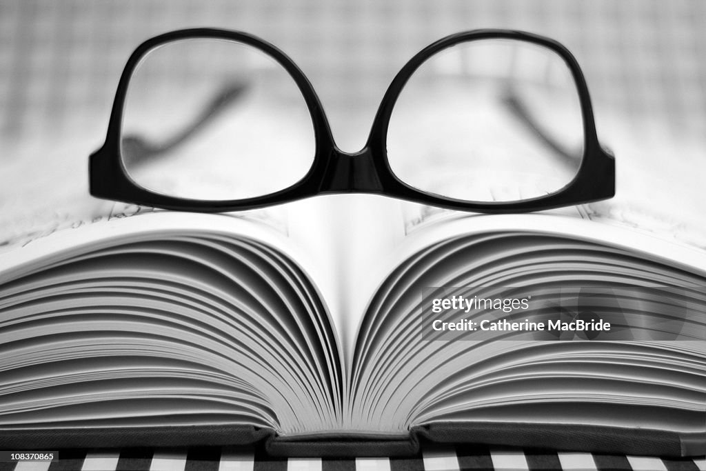 Glasses on an open Book