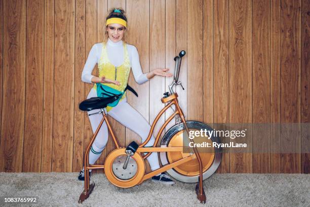 retro style exercise bike woman eighties era - sweet bizarre vintage rides imagens e fotografias de stock