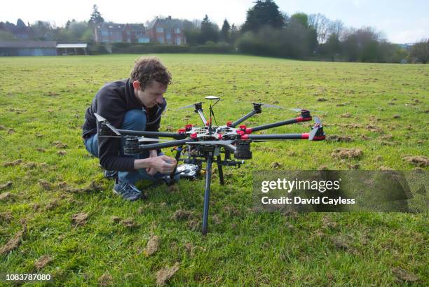 a cameraman check over his drone - gifted movie stock pictures, royalty-free photos & images