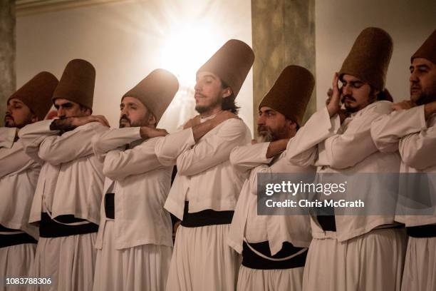 Whirling Dervishes take part in a Sema Prayer Ceremony at the Yenikapi Mevlevihanesi marking the anniversary of the death of Mevlana Jalal al-Din...