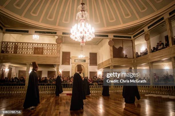 Whirling Dervishes take part in a Sema Prayer Ceremony at the Yenikapi Mevlevihanesi marking the anniversary of the death of Mevlana Jalal al-Din...