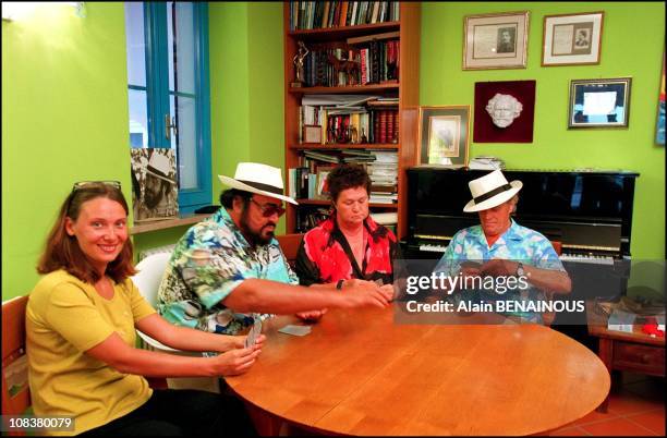 Nicoletta, Luciano Pavarotti, his sister Gabriella and his father Fernando playing cards in Pesaro, Italy on August 20, 2001.