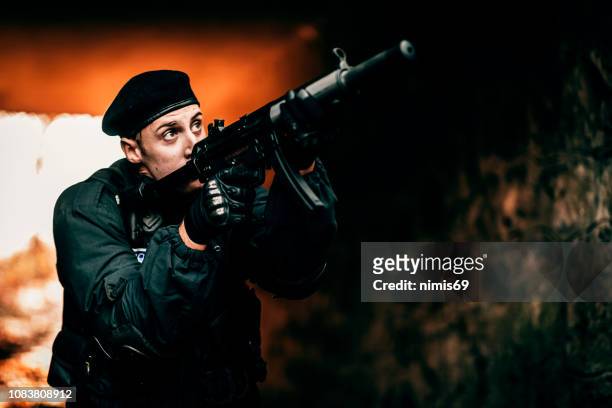 swat police officer shooting with firearm - rocket munition stock pictures, royalty-free photos & images