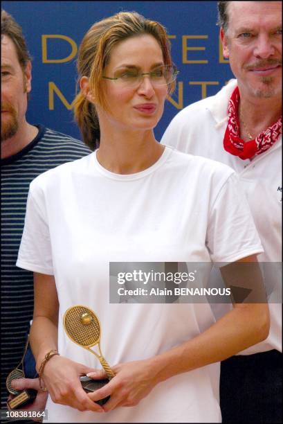 Prince Albert of Monaco and his friend Alexandra Kamp participate in tennis tournament of the forty-second film festival of Monaco on July 06, 2002.