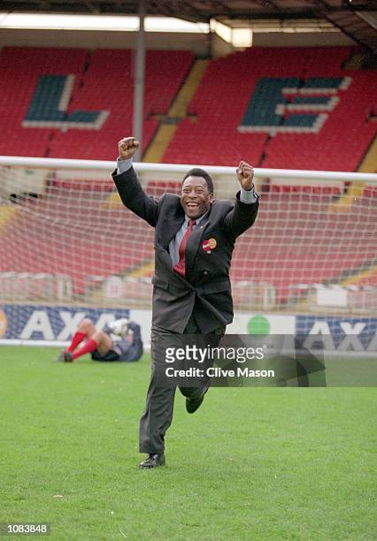Pele celebrates after scoring past Gordon Banks during an AXA photocall at Wembley in London. \ Mandatory Credit: Clive Mason /Allsport